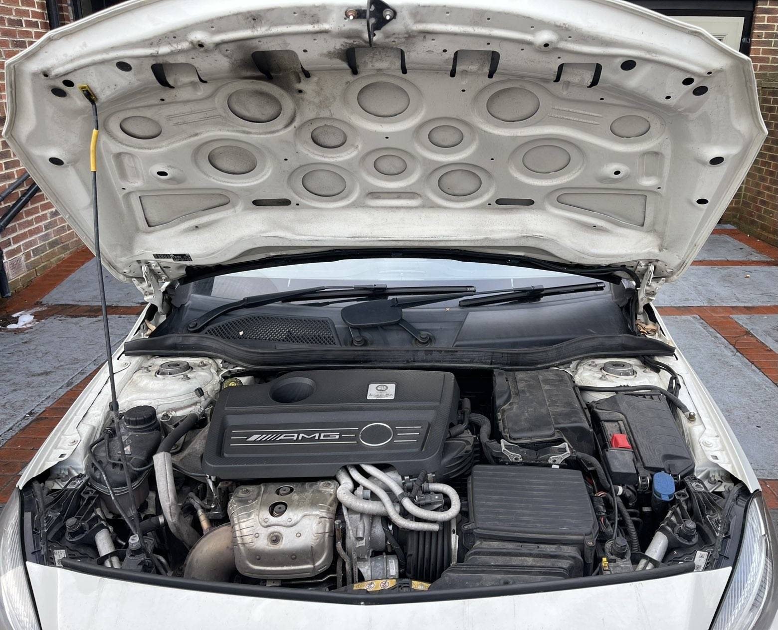 Mercedes engine bay before detailing